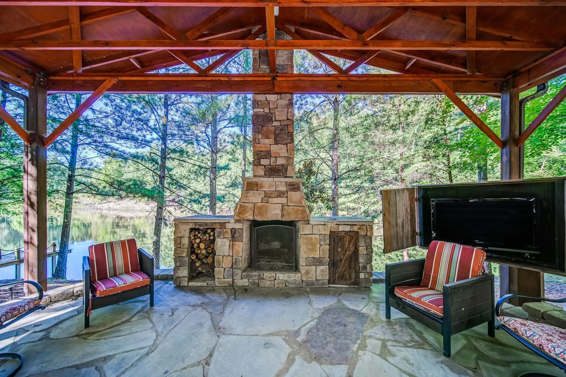 Stone pavilion and fireplace overlooking the private lake at Casa Campo